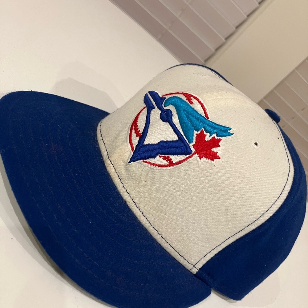 Blue and White Baseball Cap with Bird Logo